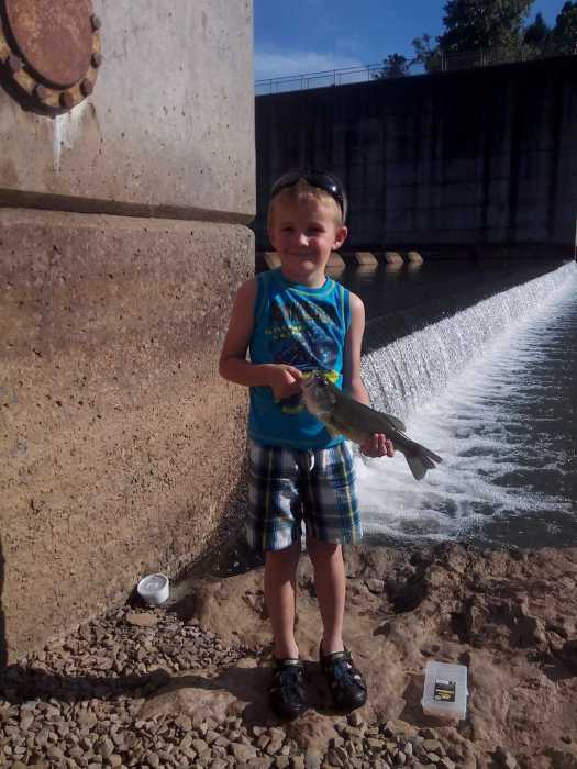 Six-year-old Kyrian caught a large mouth bass at Burnsville Dam.