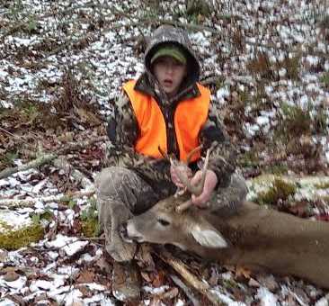 Fourteen-year-old BJ with his six-point buck he killed in Braxton County.