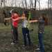 BTB Member Carlee shows some beginners how to shoot a bow.